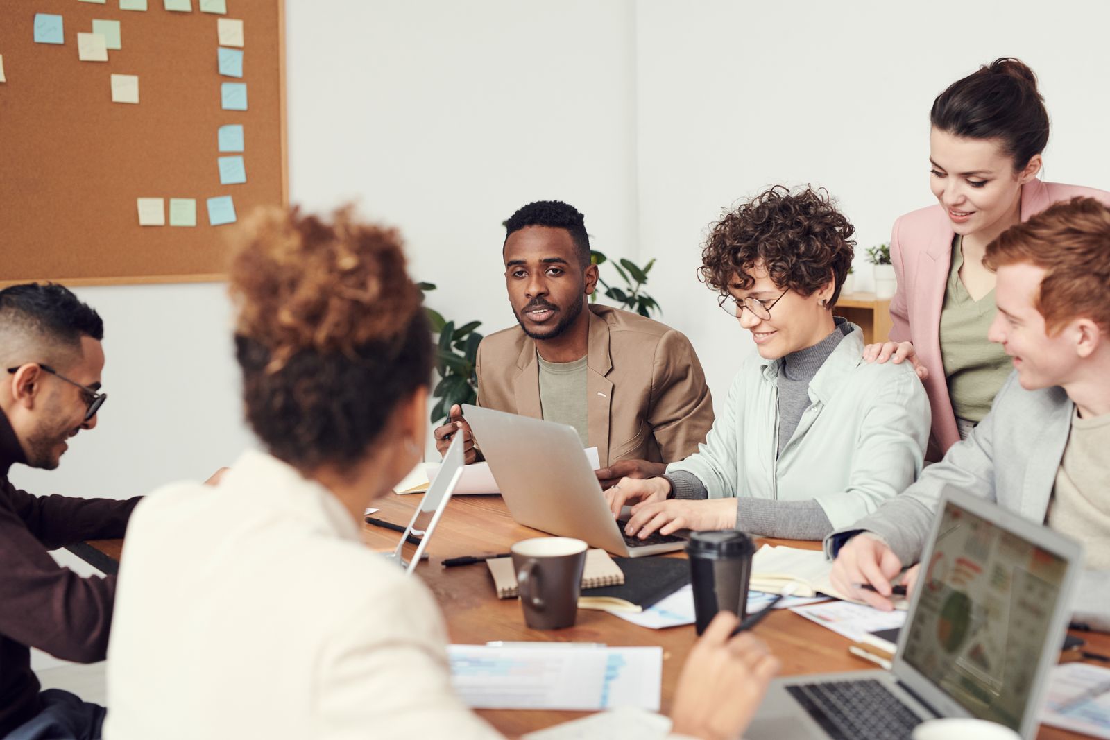 People reviewing information together on a laptop